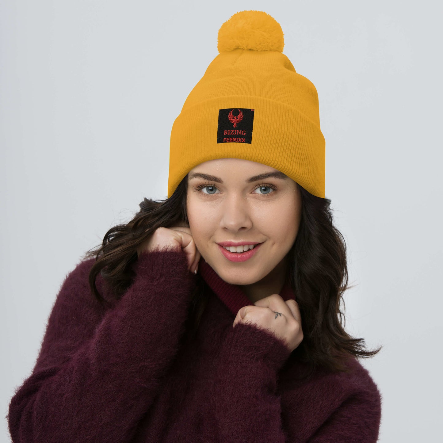 RIZING FEENIXX™ POM-POM BEANIE