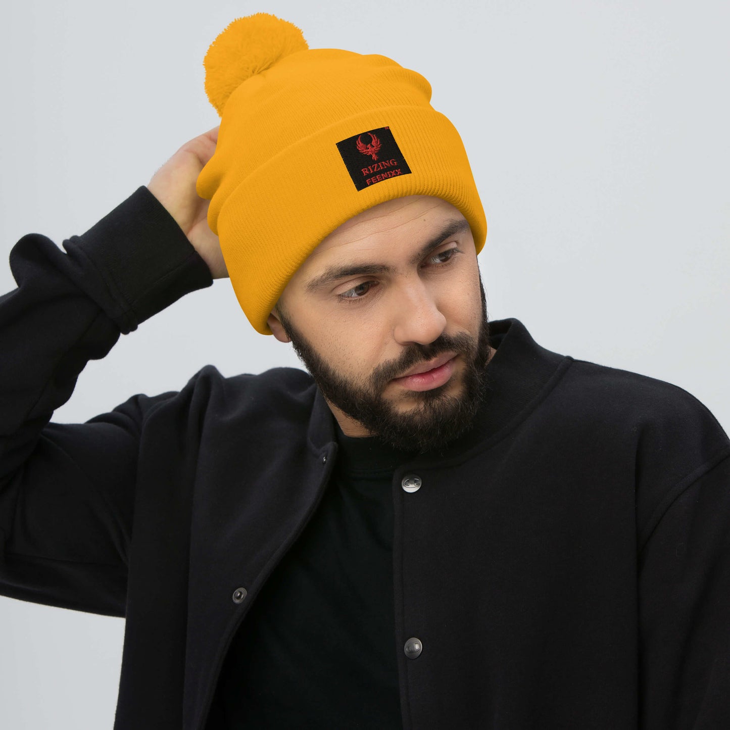 RIZING FEENIXX™ POM-POM BEANIE