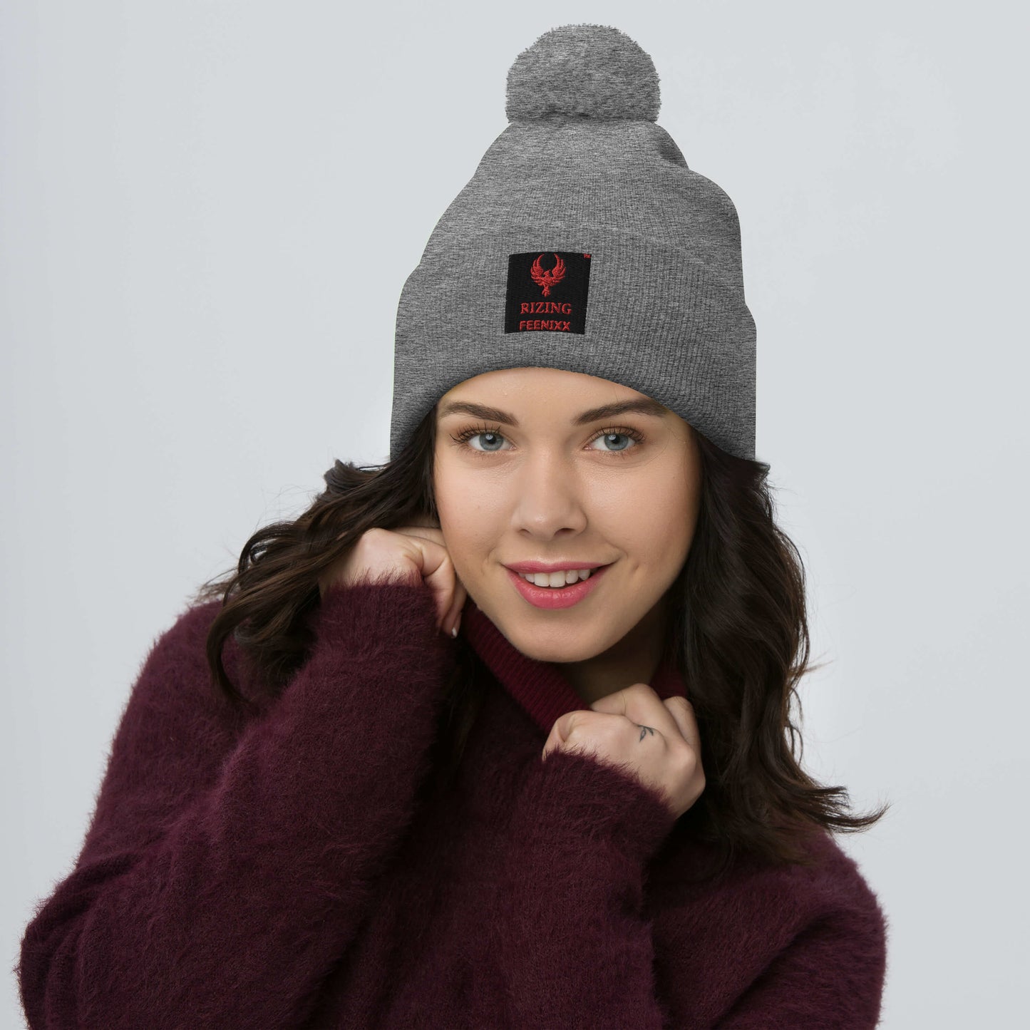 RIZING FEENIXX™ POM-POM BEANIE